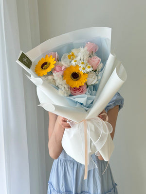 Premium soap flower bouquet with sunflower and pink rose mix in blue theme, perfect for university graduation Bukit Jalil same day delivery.