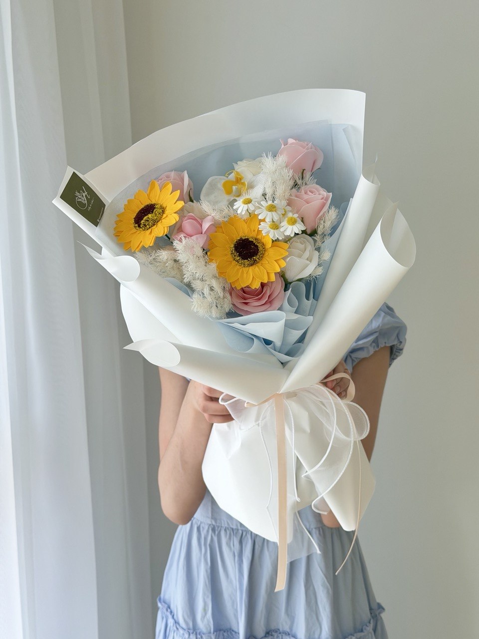 Premium soap flower bouquet with sunflower and pink rose mix in blue theme, perfect for university graduation Bukit Jalil same day delivery.