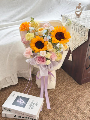 Elegant sunflower bouquet with buttercup roses and pink roses, perfect for graduation celebration in Kuala Lumpur and nearby areas.