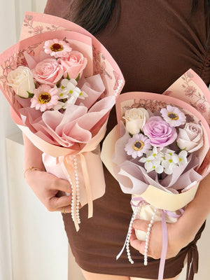 Mother’s Day soap flower bouquet in pastel pink and purple roses with daisy accents, elegant wrapping, perfect gift Kuala Lumpur same day delivery.