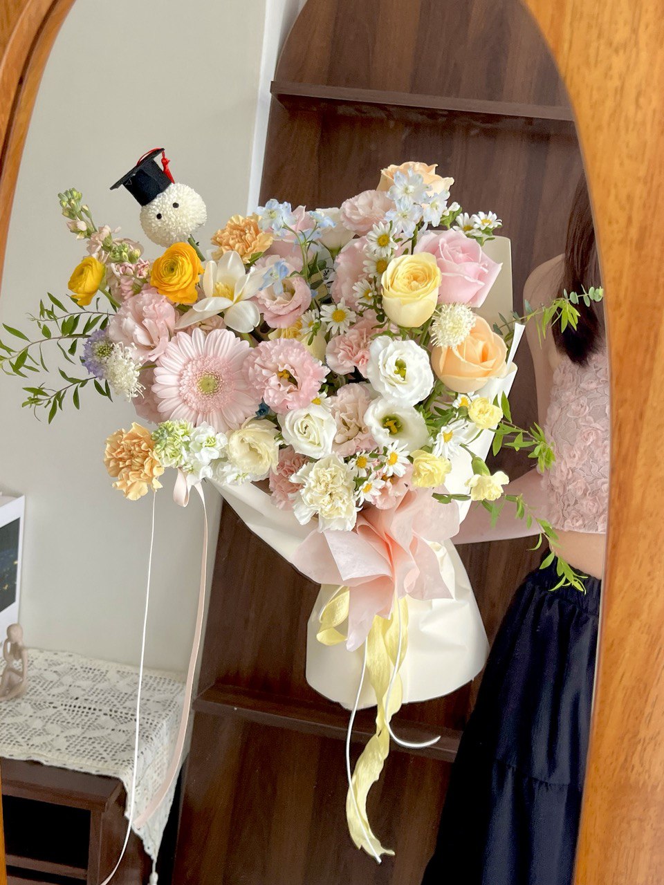 A bouquet of graduation flower with a ping pong which is wearing a graduation cap, perfect for graduation ceremony and gift.