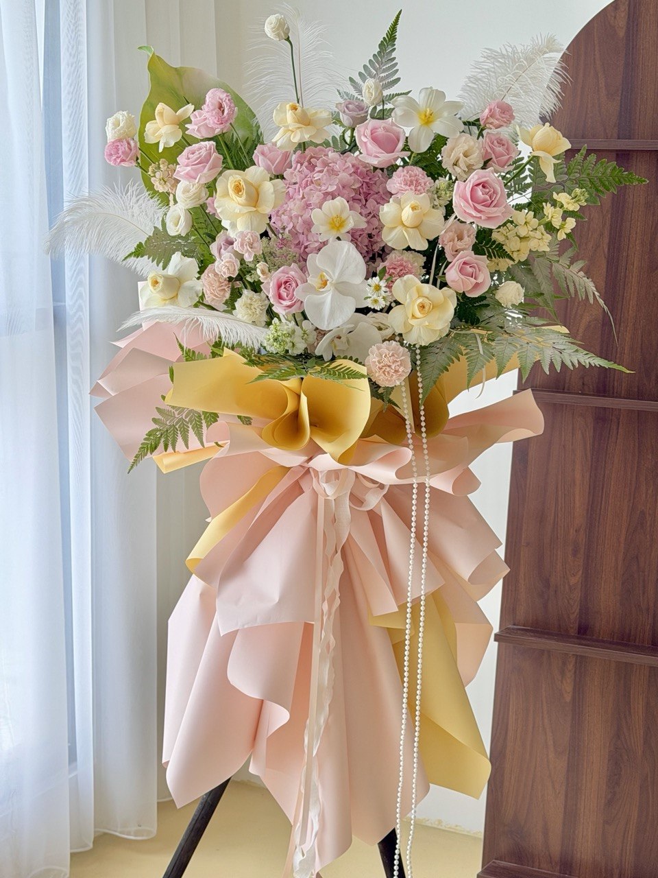 Luxury grand opening flower stand with pink roses, white orchids, hydrangea, carnations and pastel floral arrangement for business opening in Kuala Lumpur.