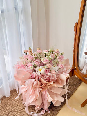 Romantic pink ballet bouquet featuring hydrangeas, roses and fresh seasonal flowers prepare by Hug and Heart Florist.