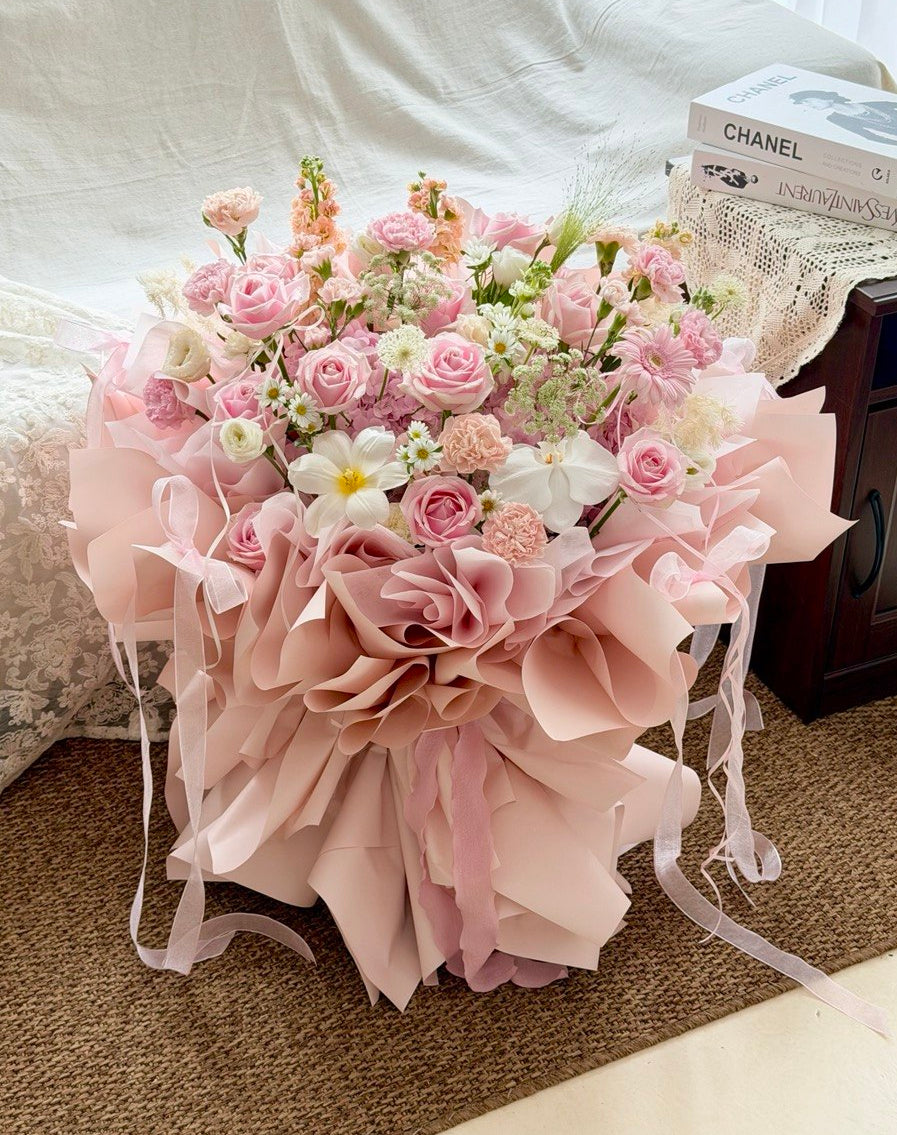 Soft pink luxury bouquet with hydrangeas, roses, carnations and delicate flowers.