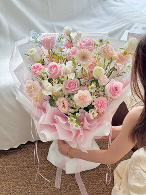 Luxe pink flower bouquet featuring pink roses, pink gerbera, pink eustoma, and white tulips with same day flower delivery in KL.