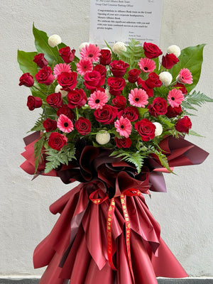 A grand opening flower stand features red rose, pink rose, ping pong and paku leaf same day delivery at Kuala Lumpur prepared by hug and heart florist sunway geo.