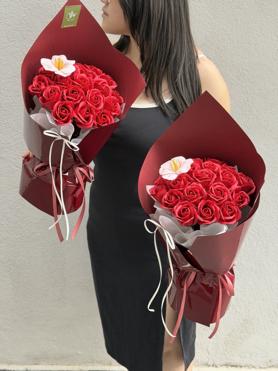 Romantic red rose soap flower bouquet with 20 stems and a peach tulip, designed by Hug and Heart Florist, same day delivery available in Kuala Lumpur Selangor.
