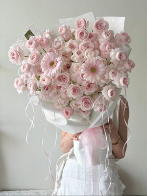 A bouquet of kiss of fairy rose spray mixed with pink gerbera prepared by Hug and Heart Florist at Kuala Lumpur.